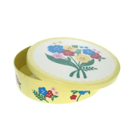 Boîte ronde en métal jaune à fleurs