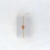 Bracelet doré pierre orangée