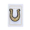 Broche brodée fer à cheval doré